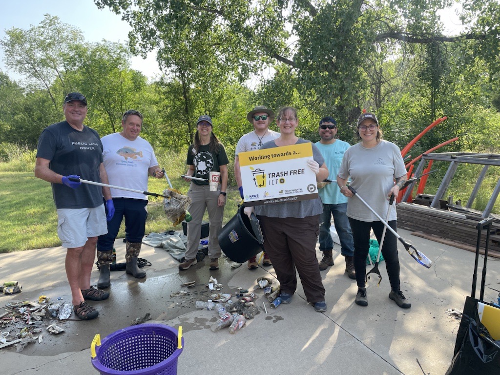 The Trash Free ICT project team poses for a picture at the site of their litter trap at Chisolm Creek during their first clean-up event.