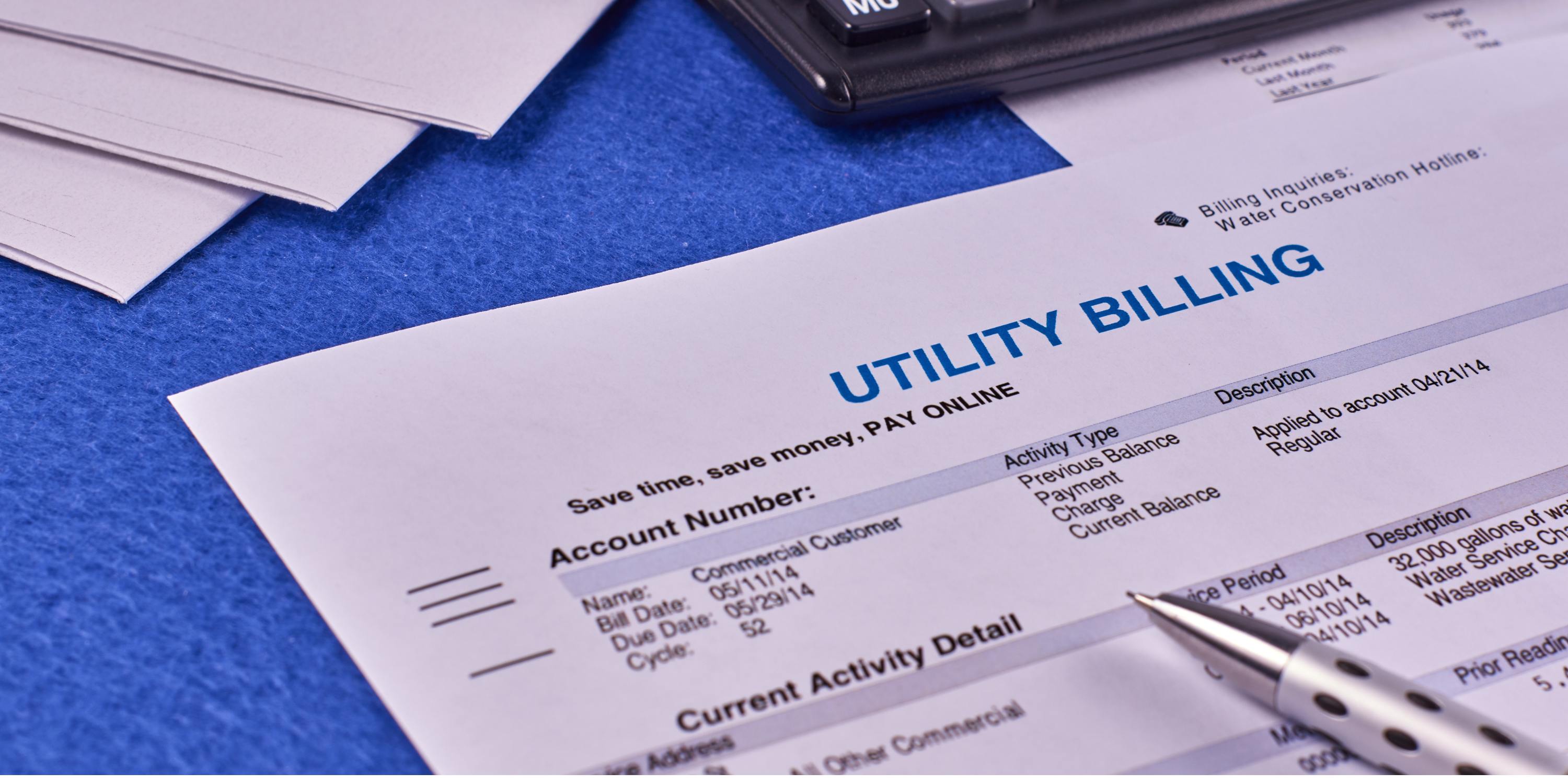 water utility bill with calculator and pen